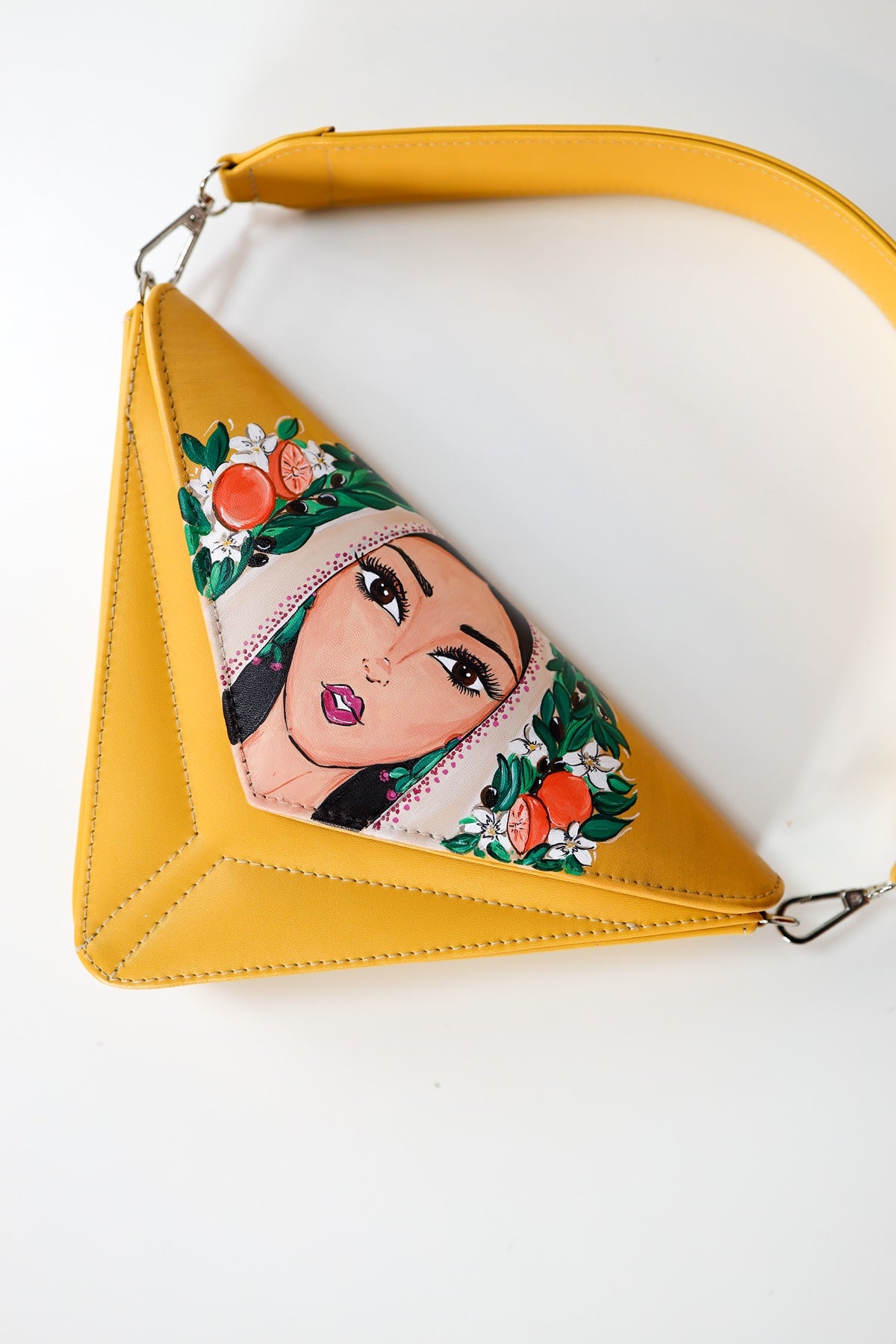 Yellow handbag with a character design on a white background