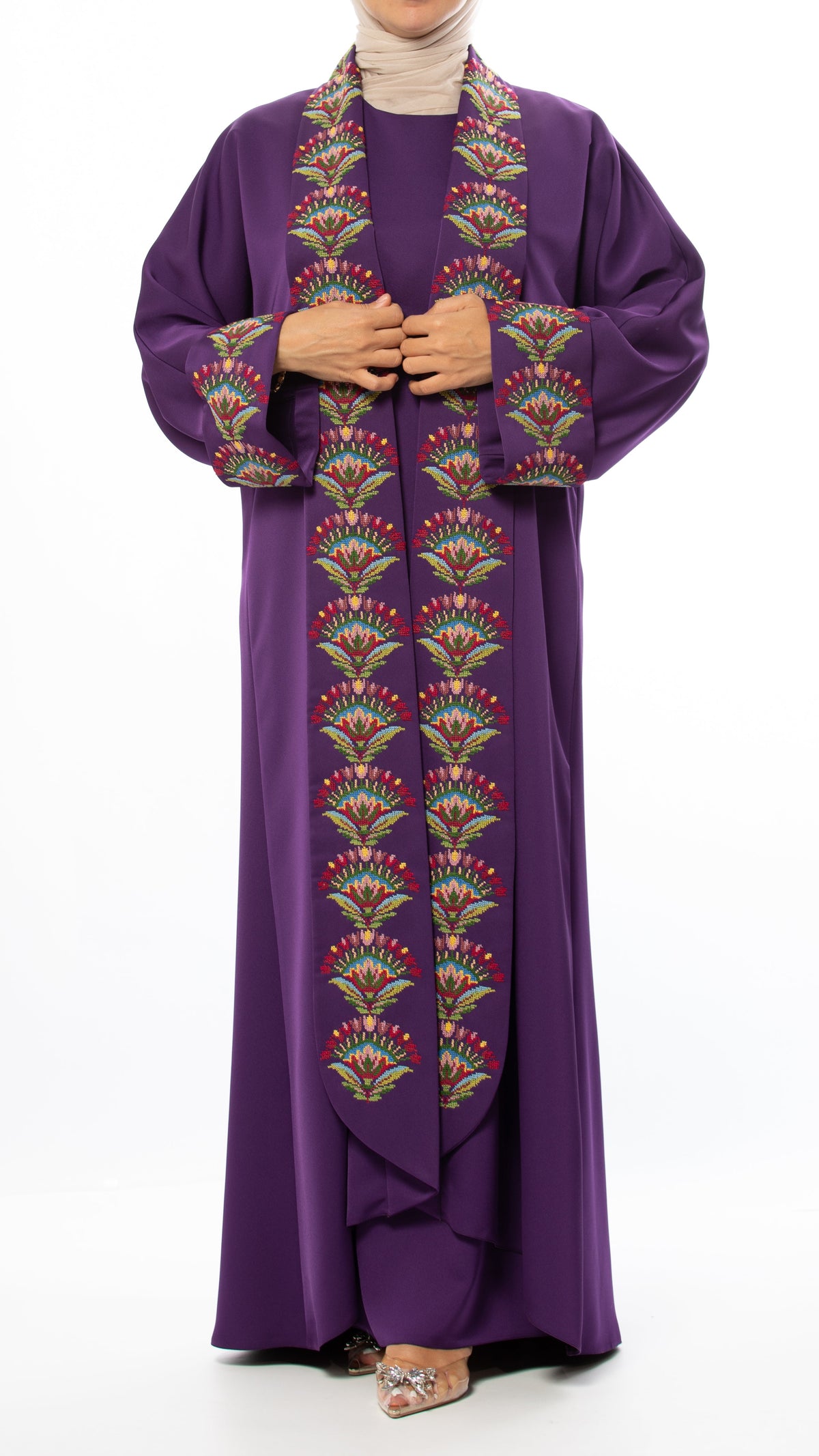 Purple dress with intricate patterns on a white background