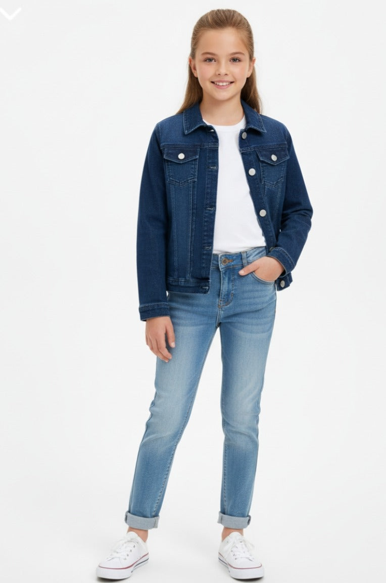 Girl wearing a blue denim jacket and jeans on a white background