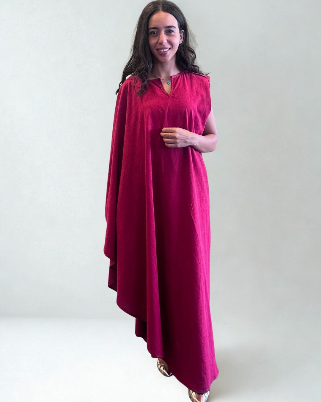Woman wearing a red dress against a white background