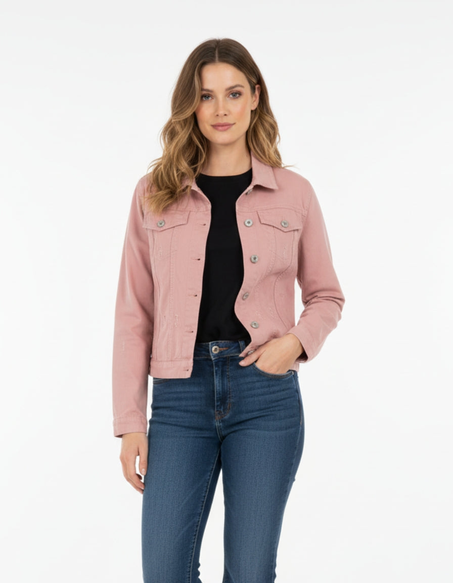Woman wearing a pink denim jacket and blue jeans on a white background