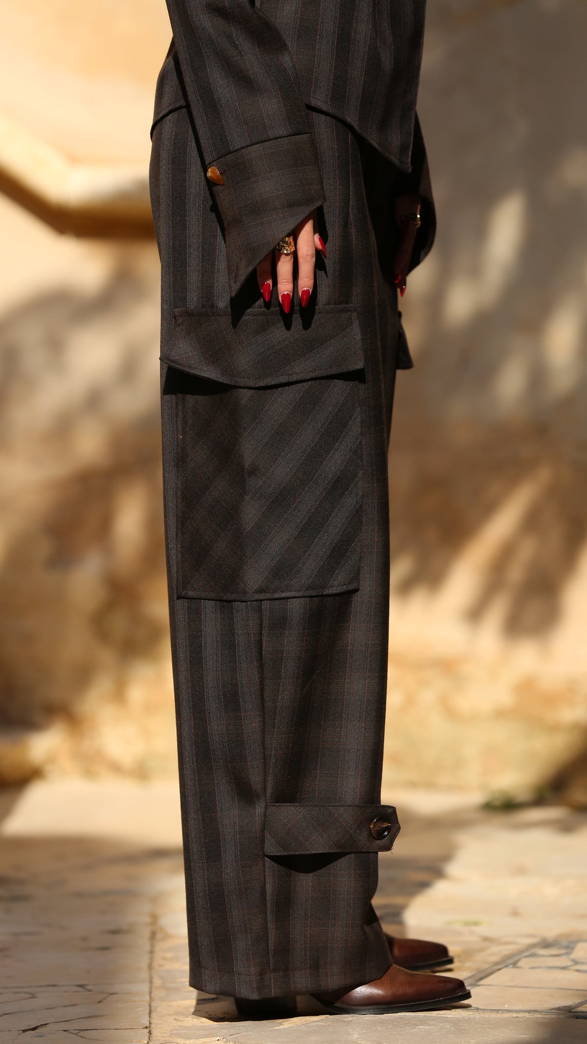 Person wearing a dark suit with a blurred background