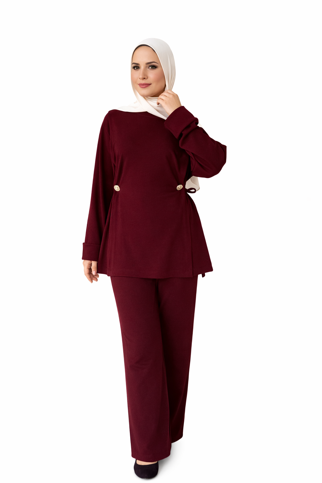 Woman wearing a burgundy outfit with a hijab on a white background