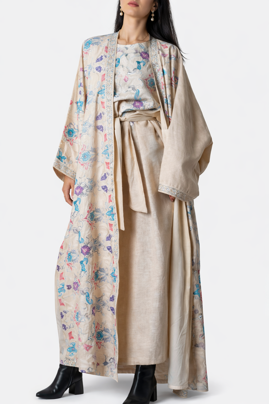 Woman wearing a floral kimono-style robe over a matching skirt on a white background