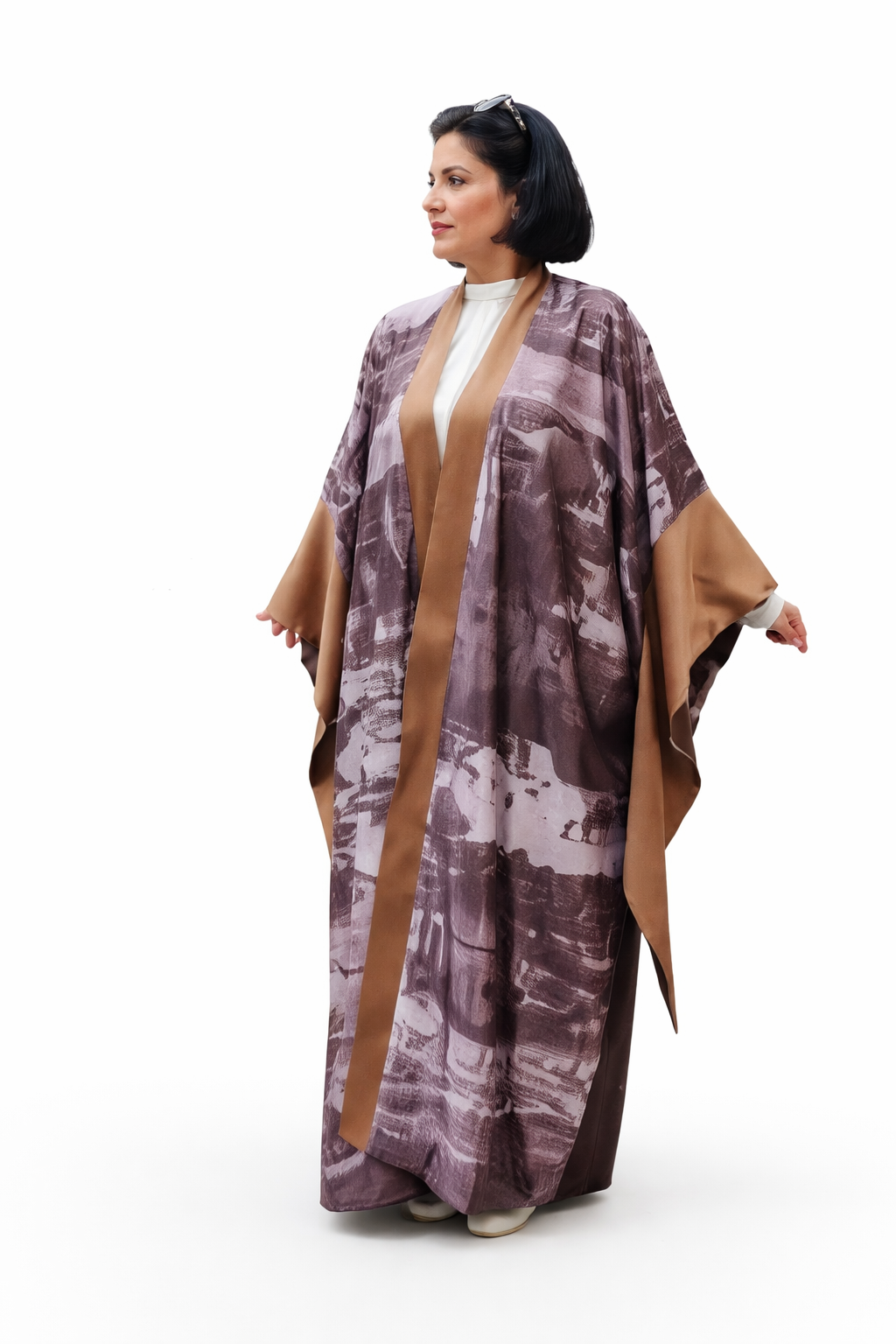 Woman wearing a patterned kimono-style garment on a white background