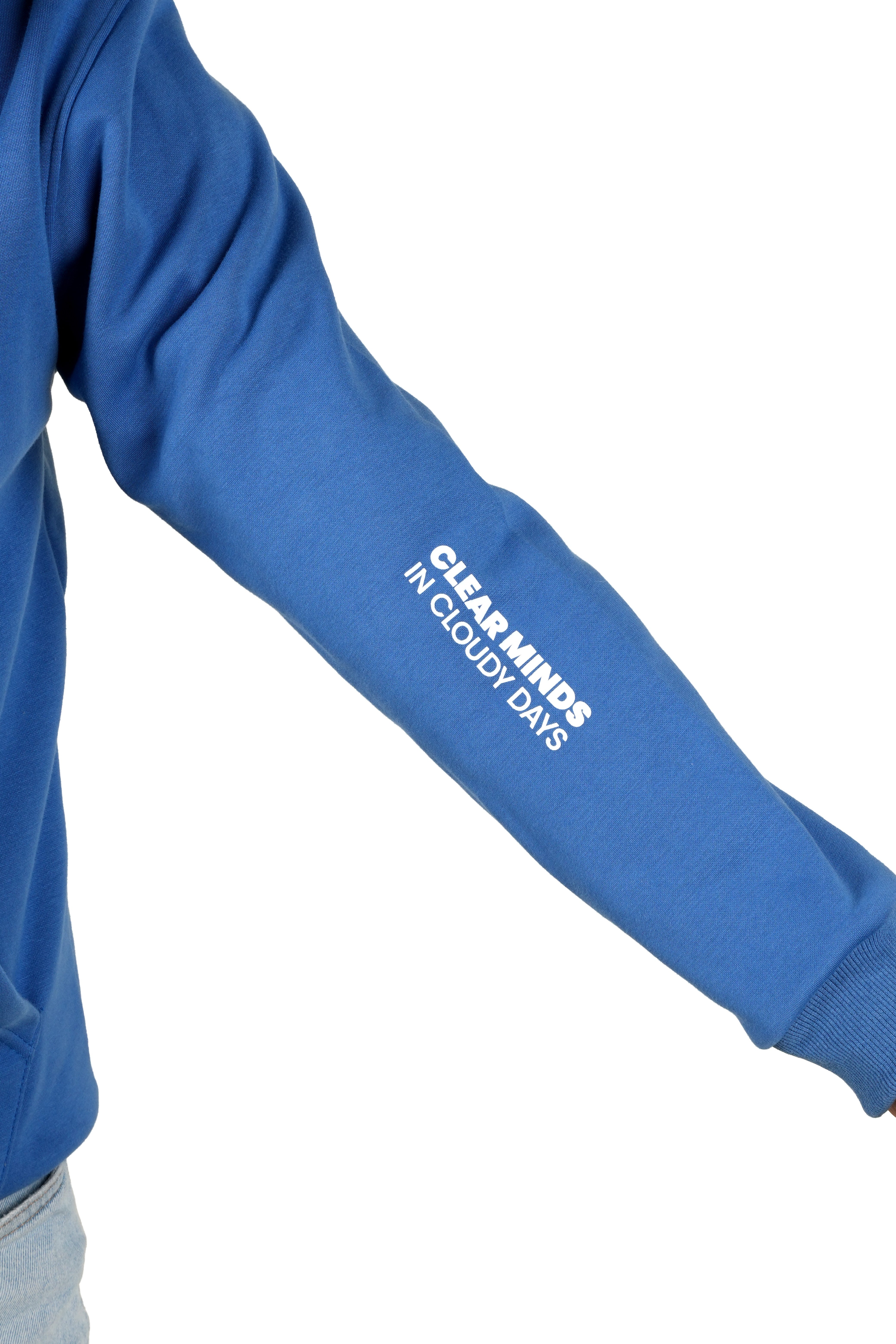 Blue sweatshirt sleeve with text 'Clear minds in cloudy days' on a white background