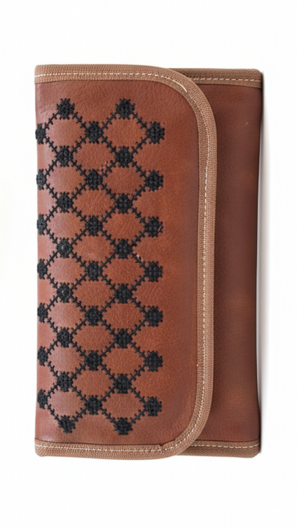 Brown wallet with black geometric pattern on a white background