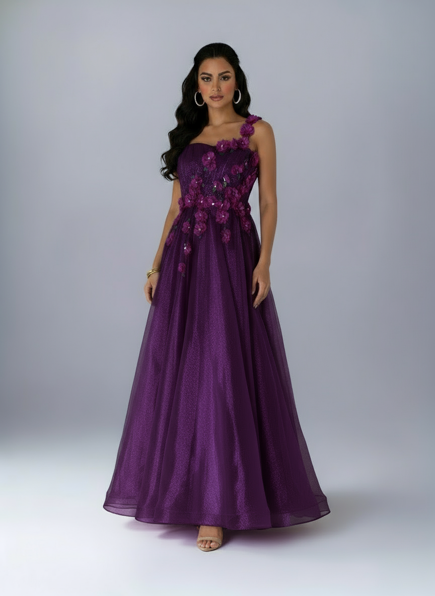 Woman wearing a purple evening gown with floral embellishments on a white background