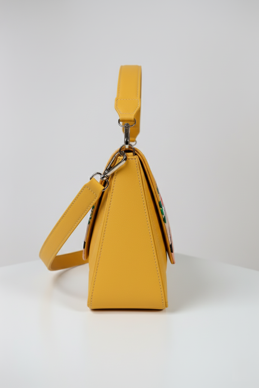 Yellow handbag with a character design on a white background