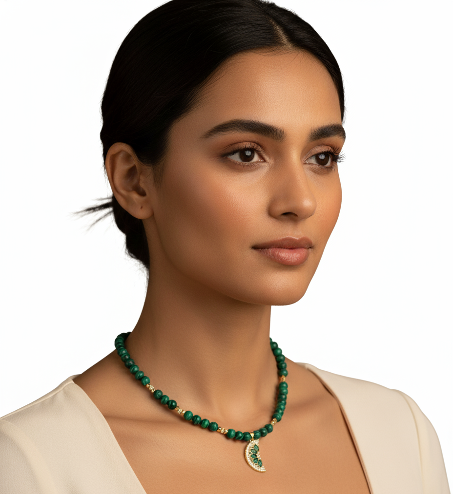 Woman wearing a green necklace on a white background