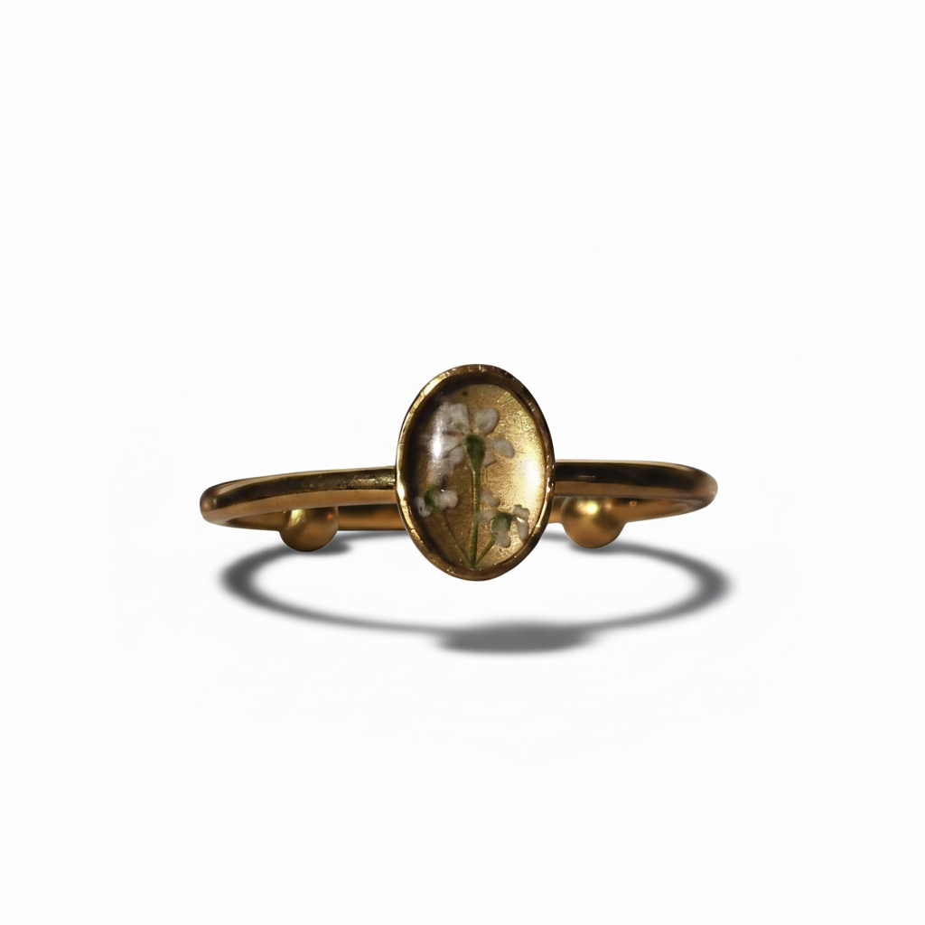 Gold ring with a circular stone on a white background