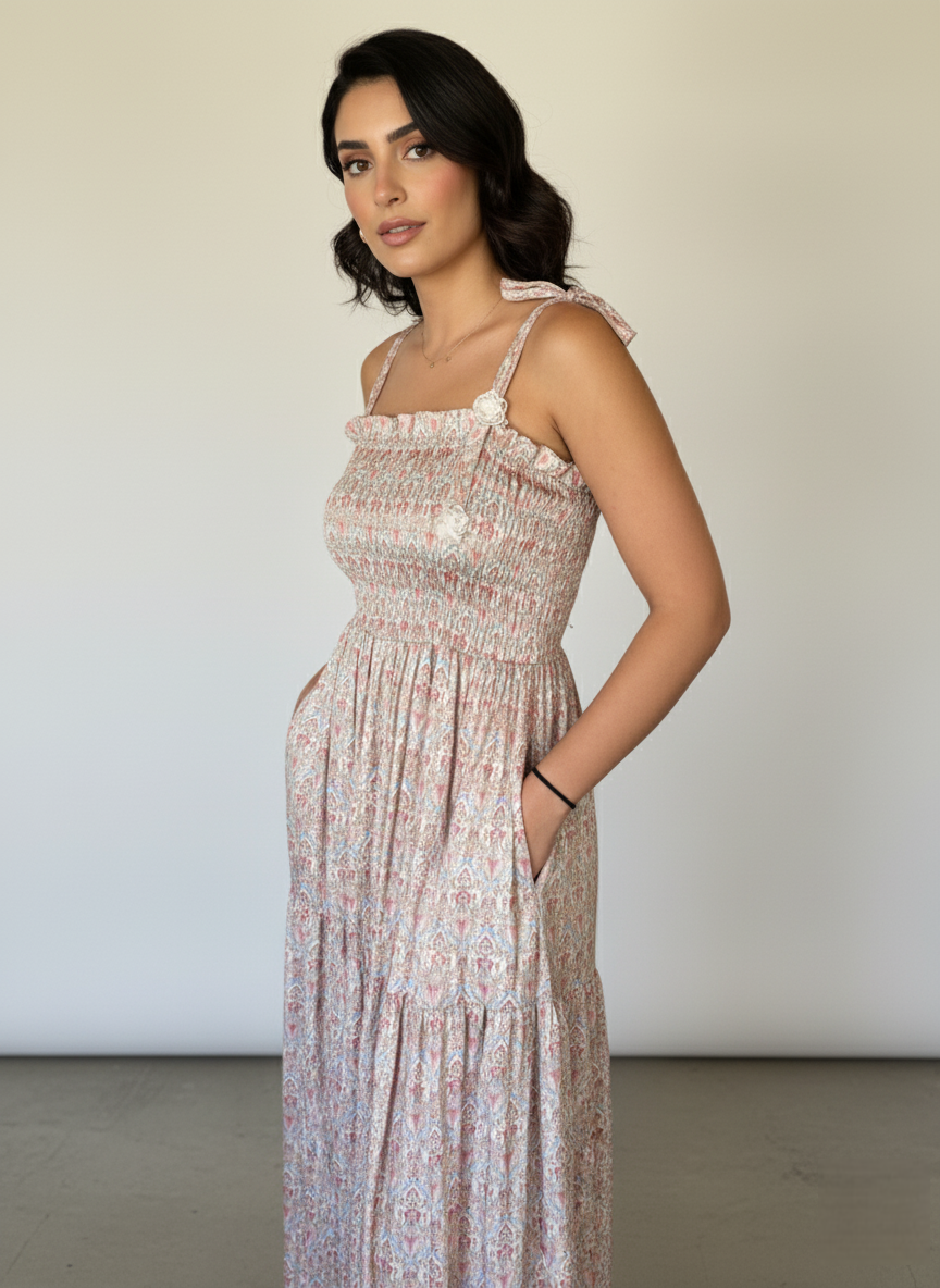 Woman wearing a floral dress against a plain background