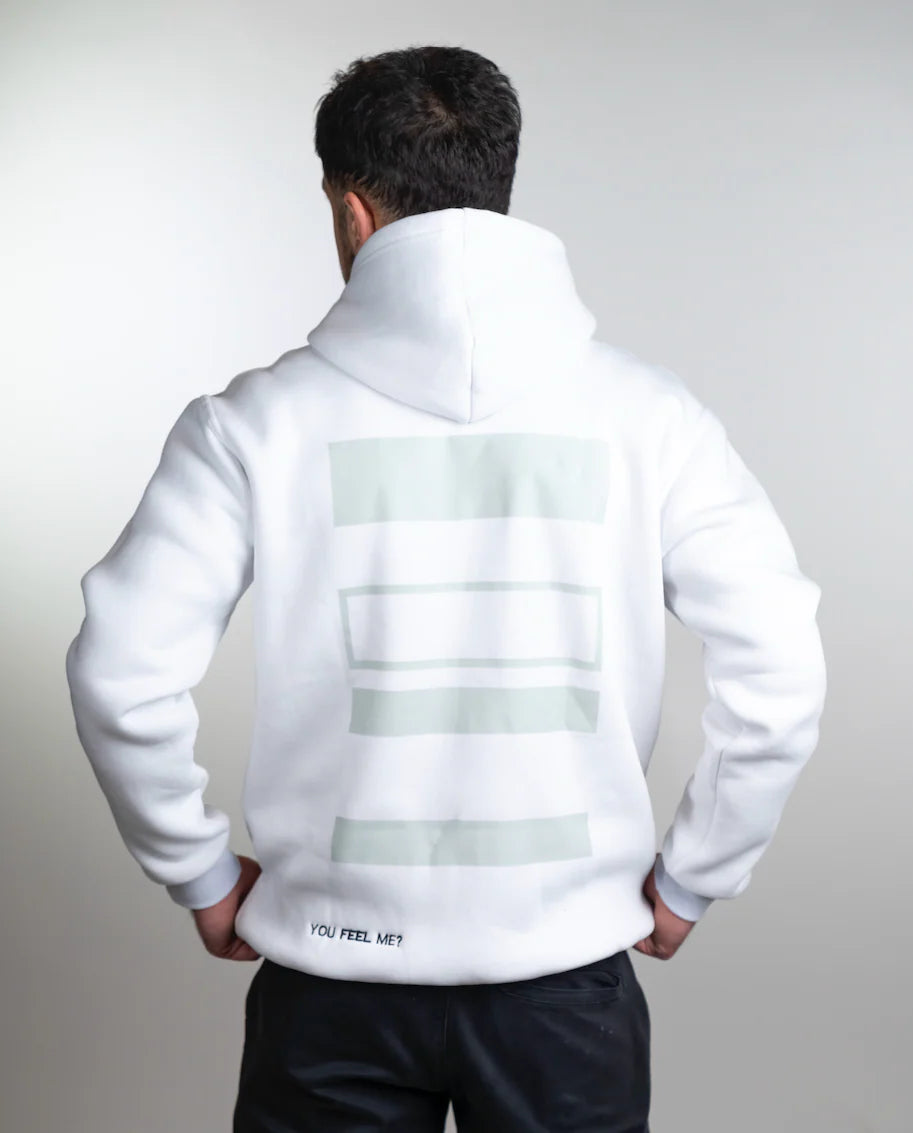 Person wearing a white hoodie with text on the back against a light gray background