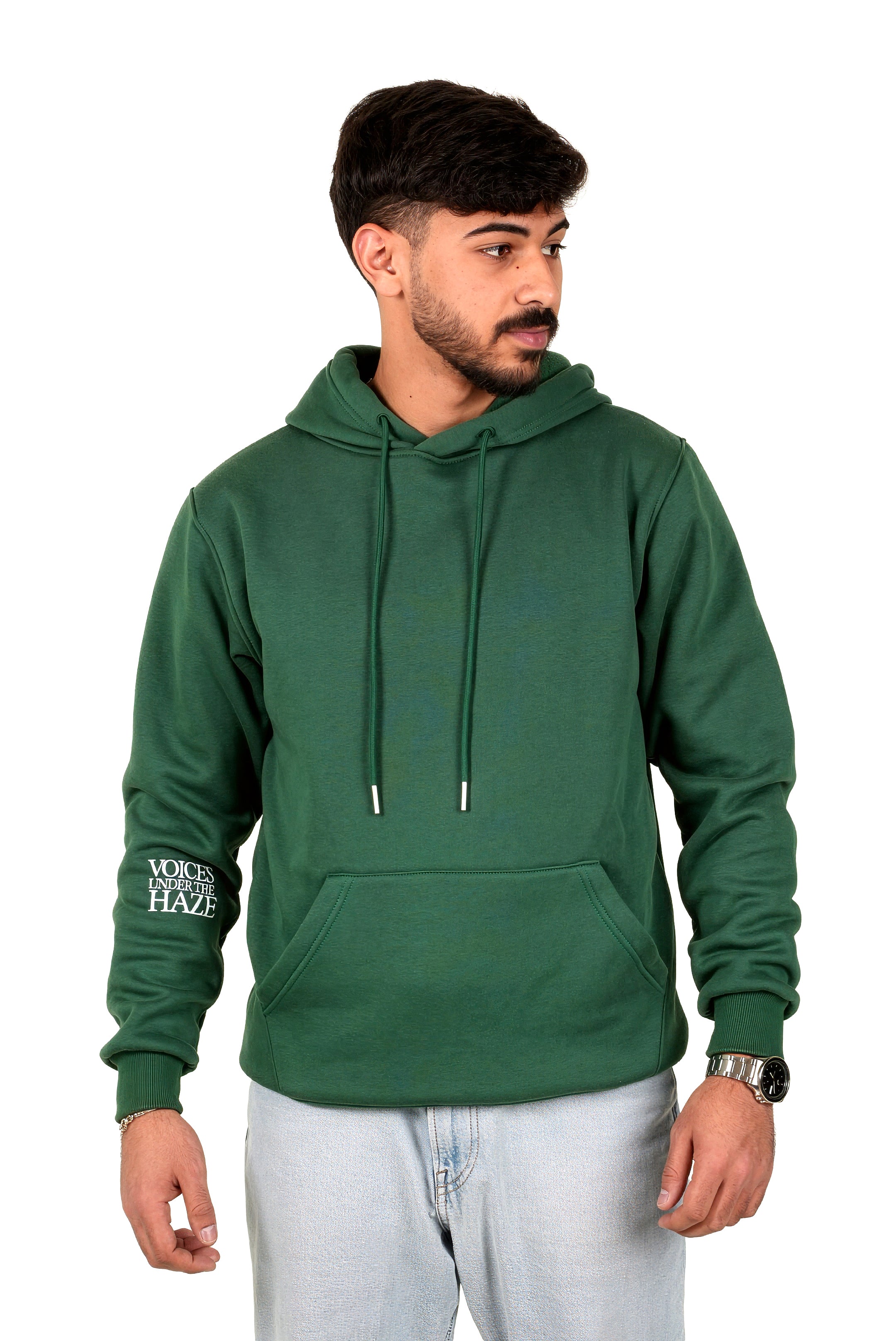 Man wearing a green hoodie with text on sleeves against a white background