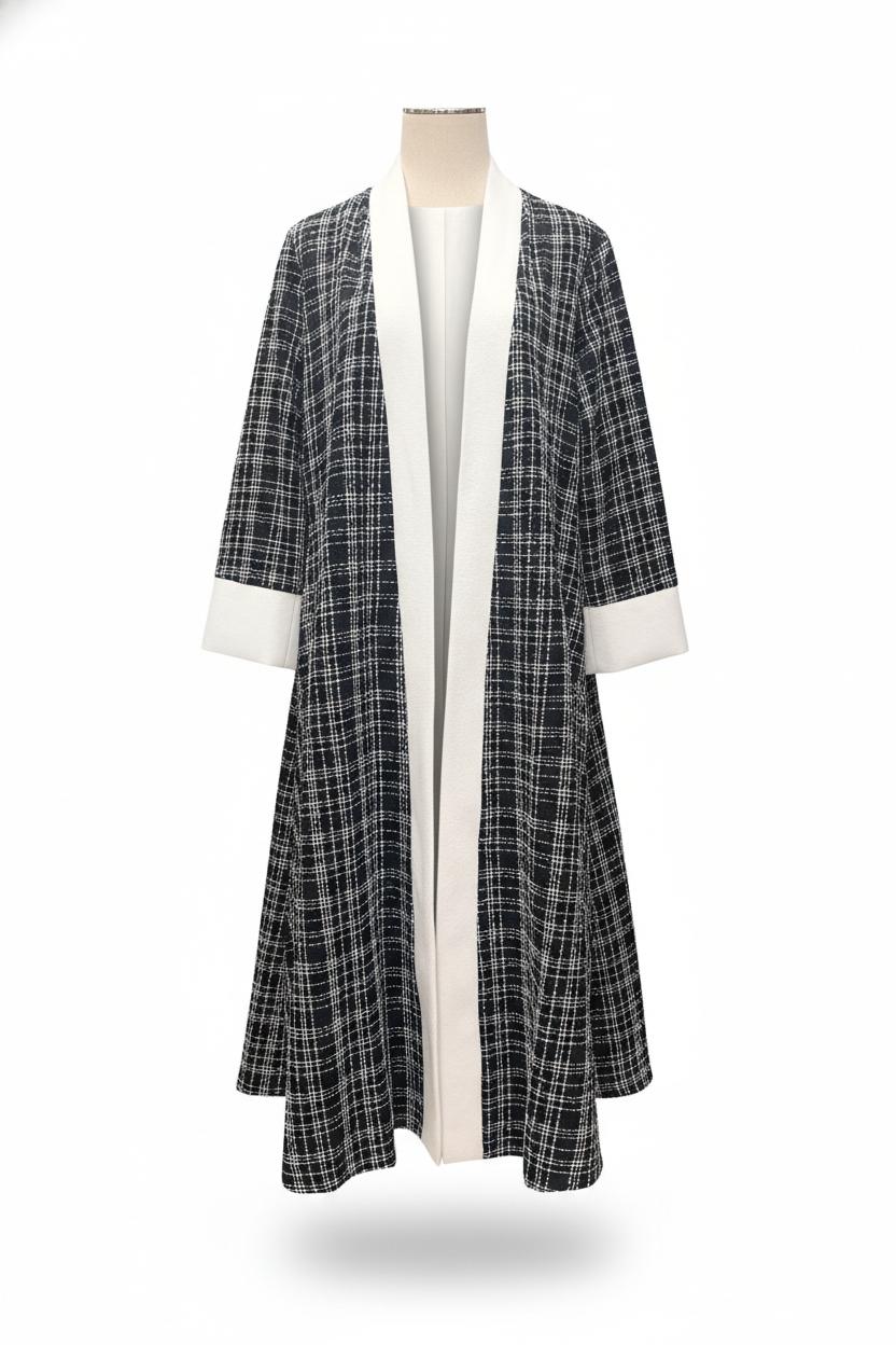 Plaid coat with white trim on a mannequin against a white background