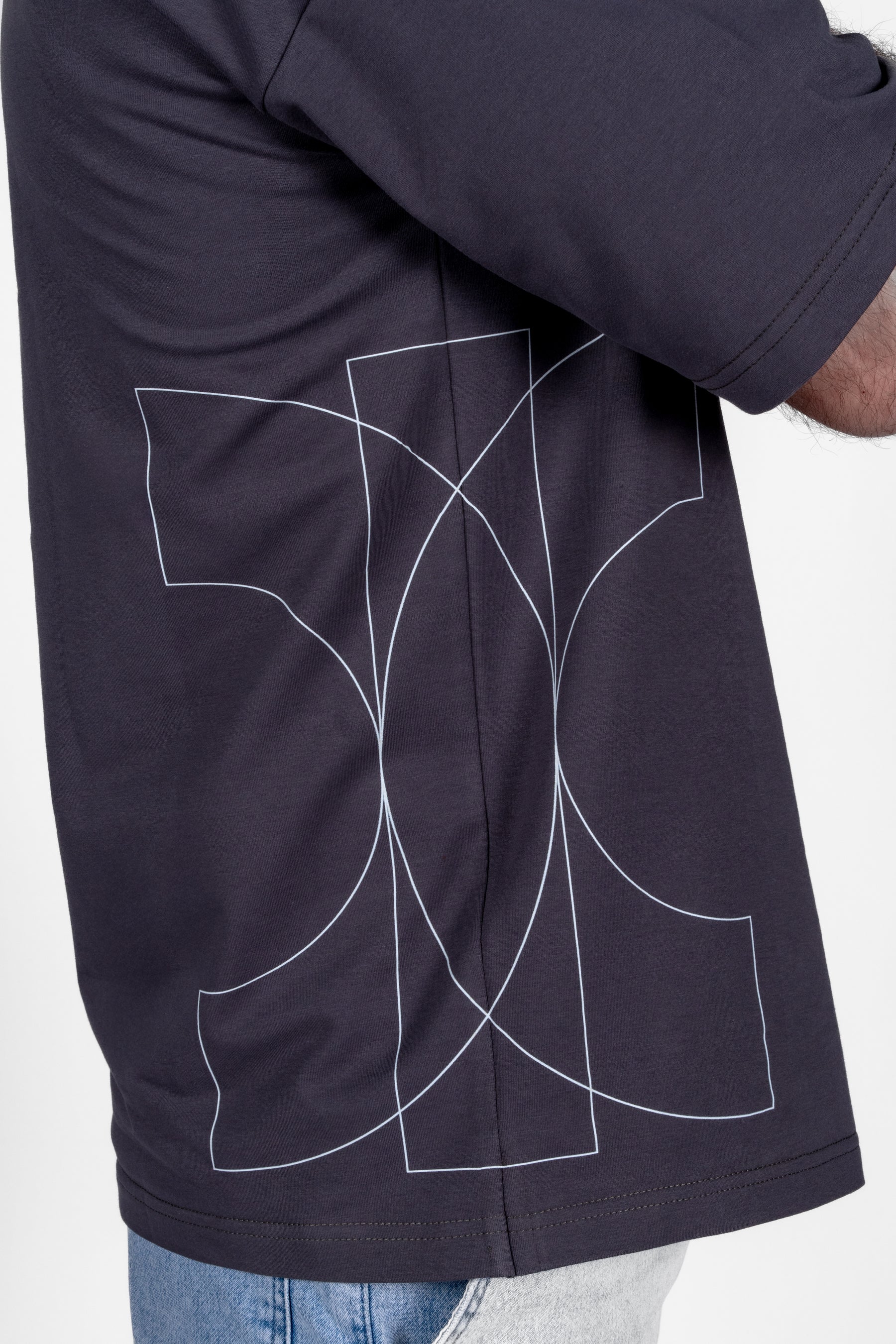 Navy jacket with a white abstract design on the back against a white background