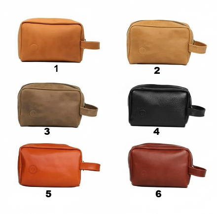 Set of six leather toiletry bags in different colors on a white background