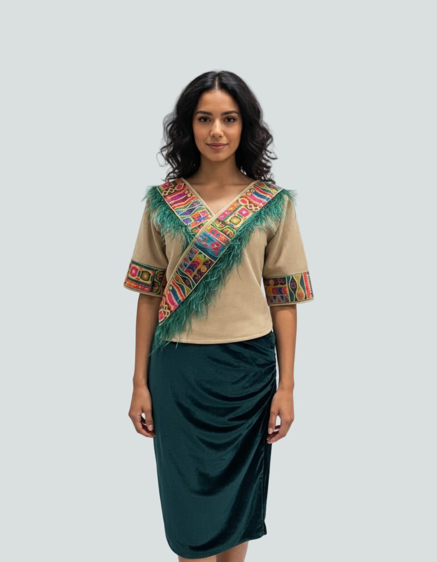 Woman wearing a traditional outfit with a colorful top and green skirt on a light gray background