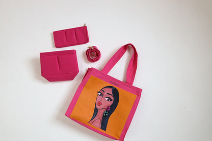 Pink tote bag with character design, pink wallet, and pink flower on a white background