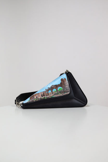 Triangular pouch with a scenic design on a light gray background
