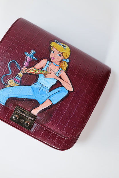 Maroon wallet with a cartoon character design on a white background