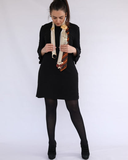 Woman holding a decorative object against a white background