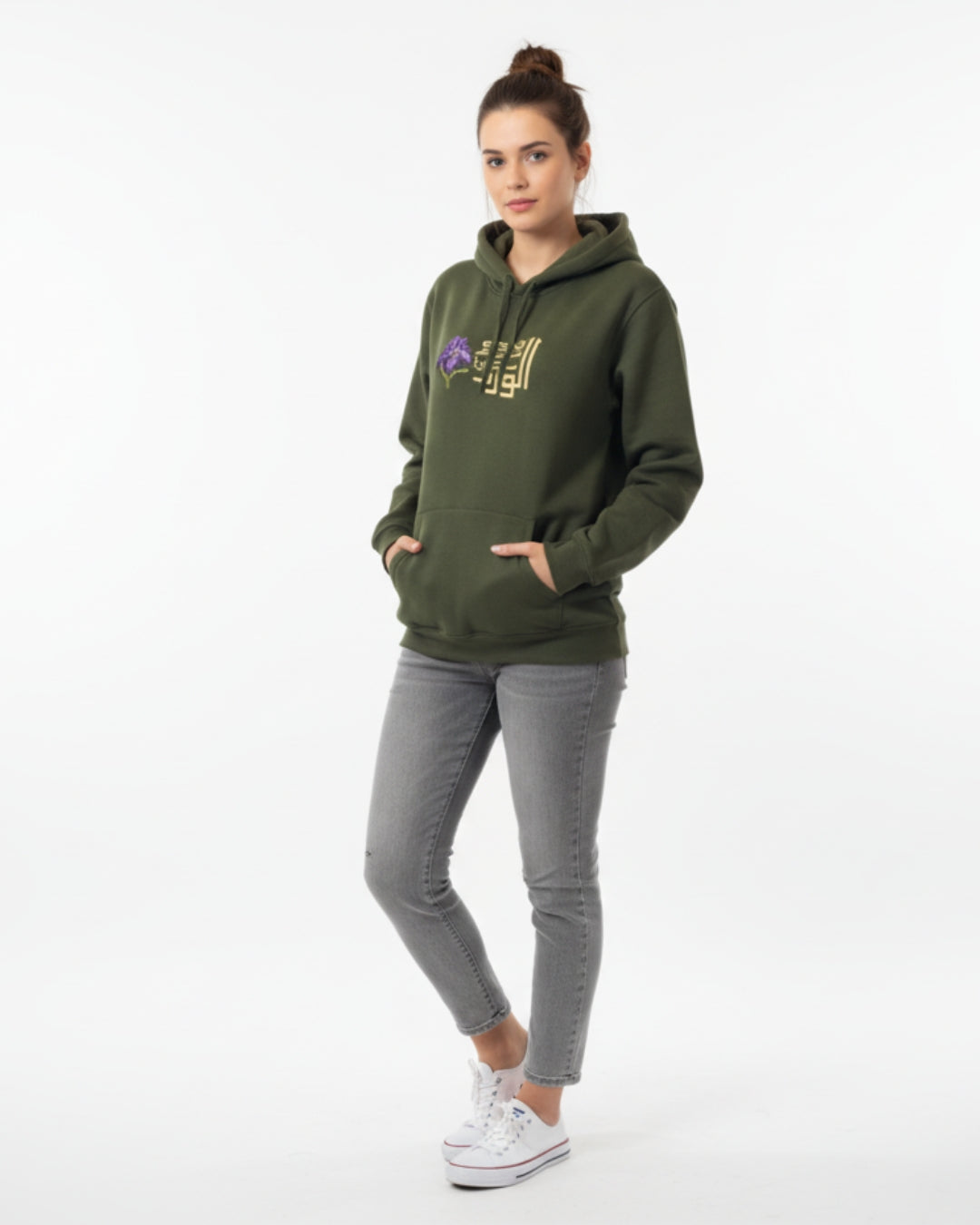 Woman wearing a green hoodie with a logo on a white background
