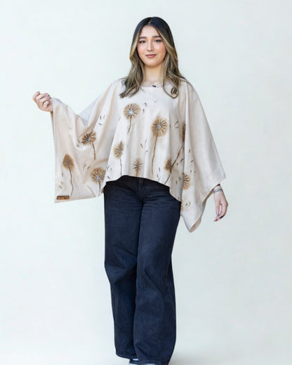 Woman wearing a beige floral scarf on a white background