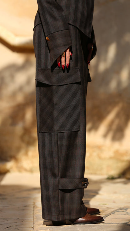 Person wearing a dark suit with a blurred background