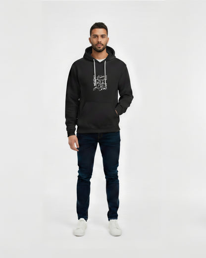Man wearing a black hoodie with text and dark jeans on a white background