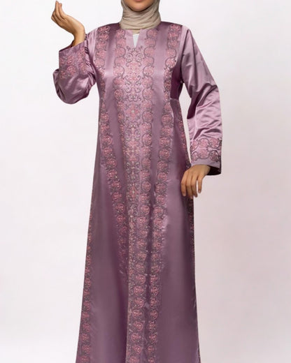 Purple embroidered dress on a white background