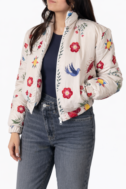 Woman wearing a floral-patterned jacket with a white background