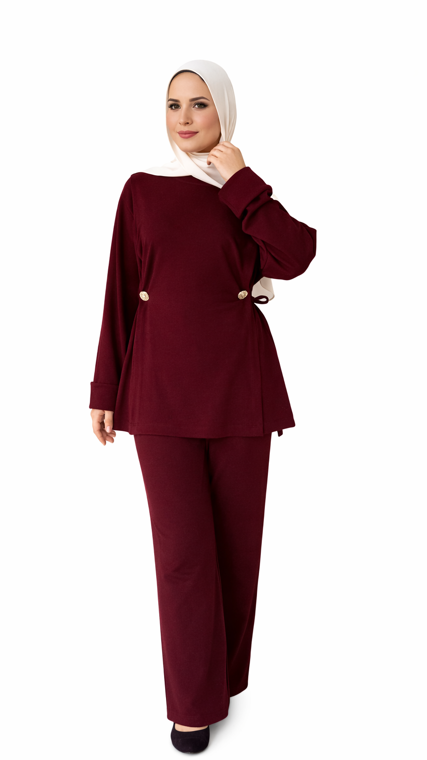 Woman wearing a burgundy outfit with a hijab on a white background