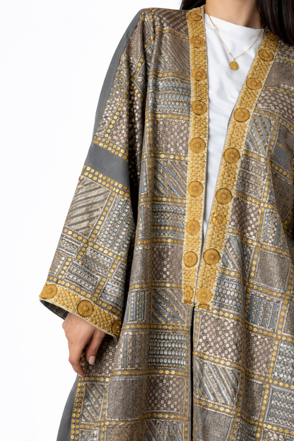 Patterned cardigan with gold buttons on a white background