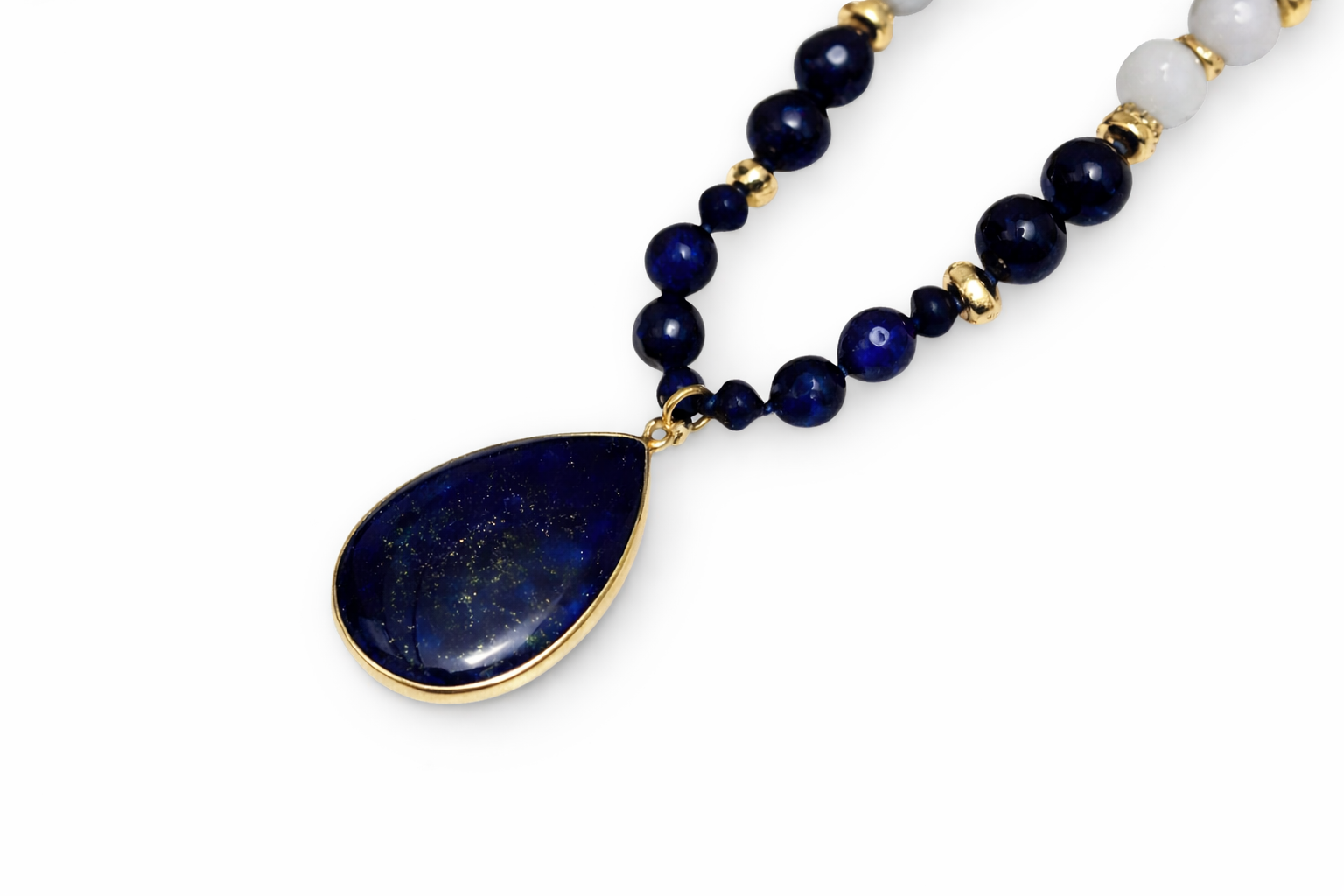 Necklace with blue teardrop pendant and beaded chain on a white background