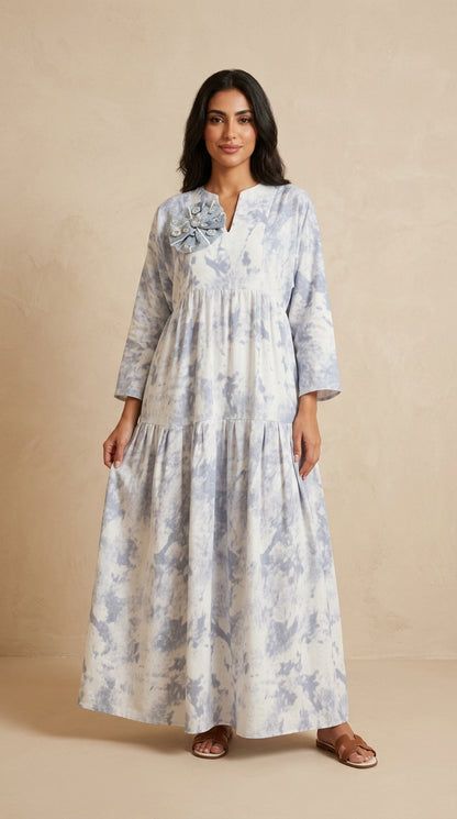 Woman wearing a floral dress on a beige background