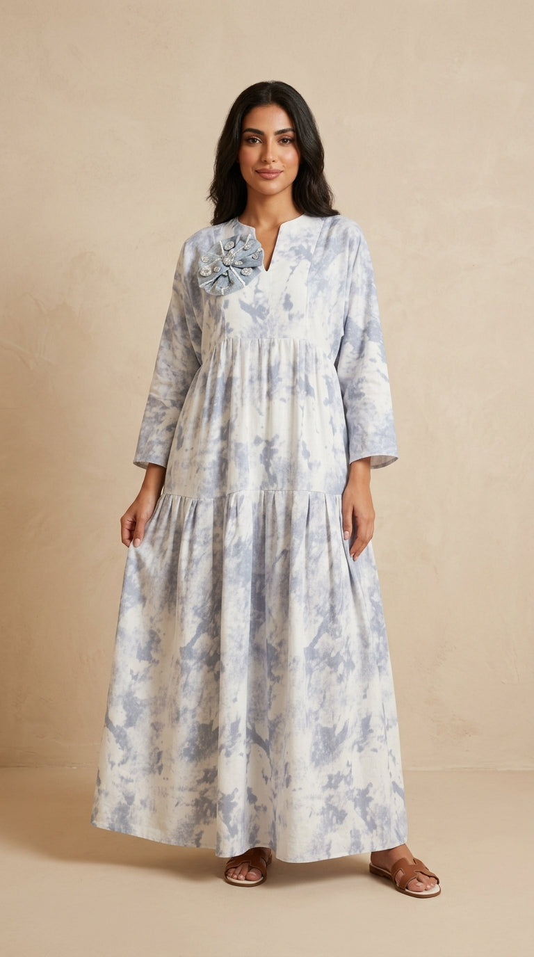 Woman wearing a floral dress on a beige background