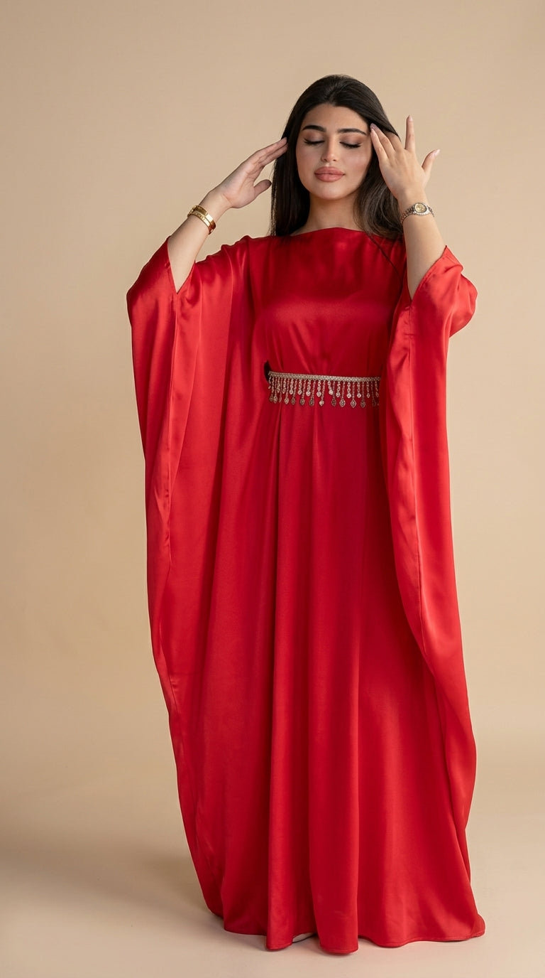 Woman wearing a red dress with a beige background