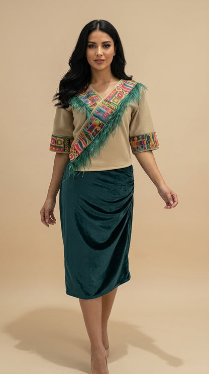 Woman wearing a traditional outfit with a beige top and green skirt on a beige background