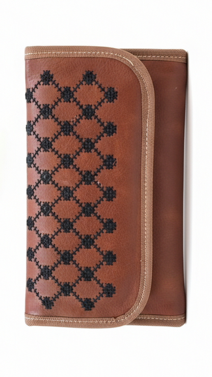 Brown wallet with black geometric pattern on a white background