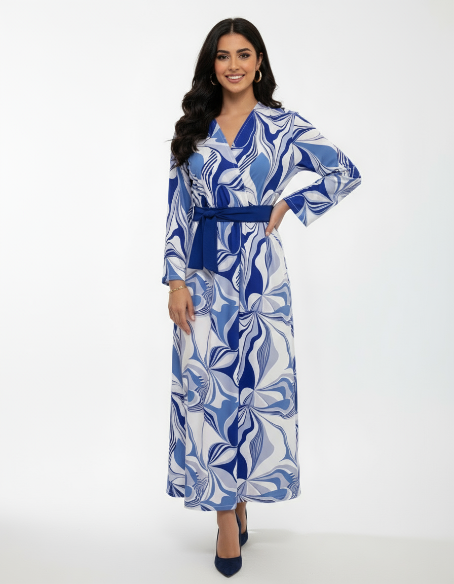Woman wearing a blue and white patterned dress on a white background