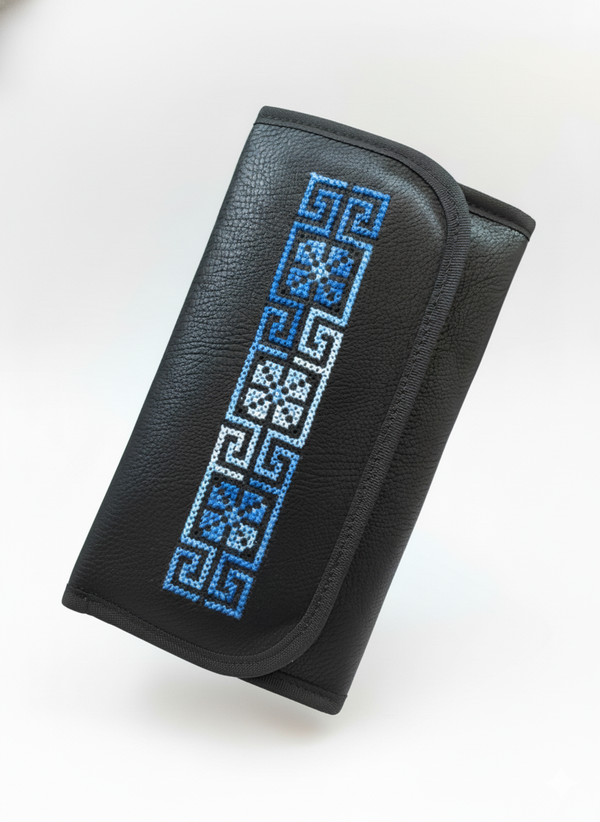 Black wallet with blue geometric pattern on a white background