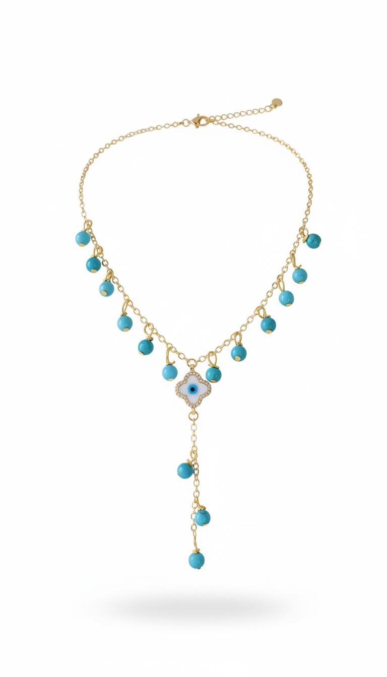Gold necklace with turquoise beads on a white background