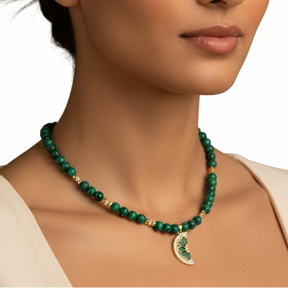 Woman wearing a green necklace on a white background