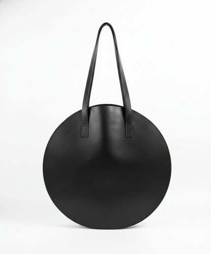 Black round handbag with handles on a white background