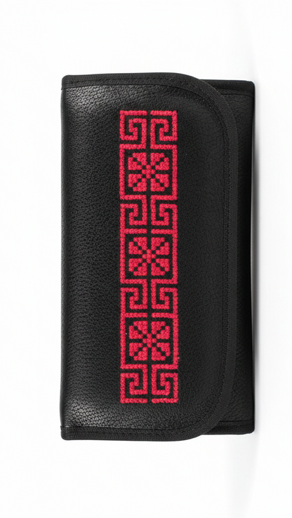 Black wallet with red geometric pattern on a white background
