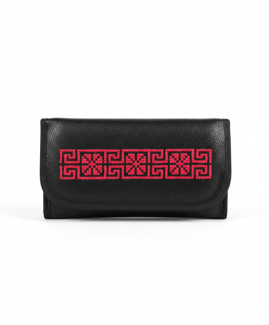 Black wallet with red geometric pattern on a white background
