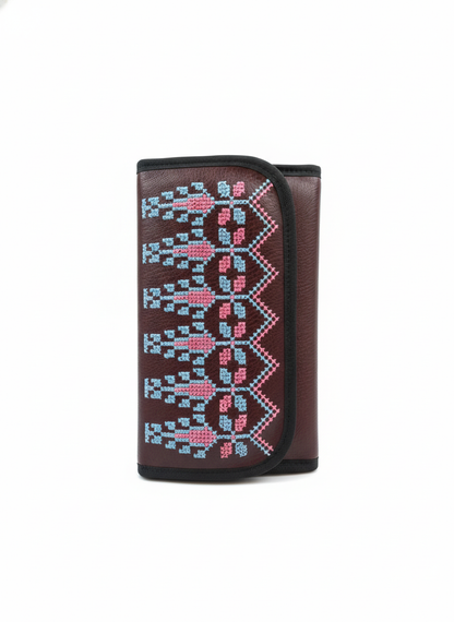 Brown wallet with embroidered pattern on a white background