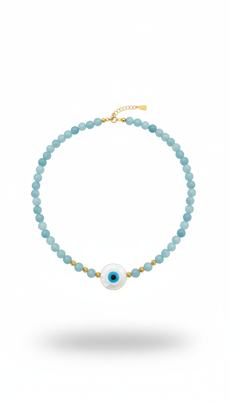 Necklace with blue beads and a white pearl pendant on a white background