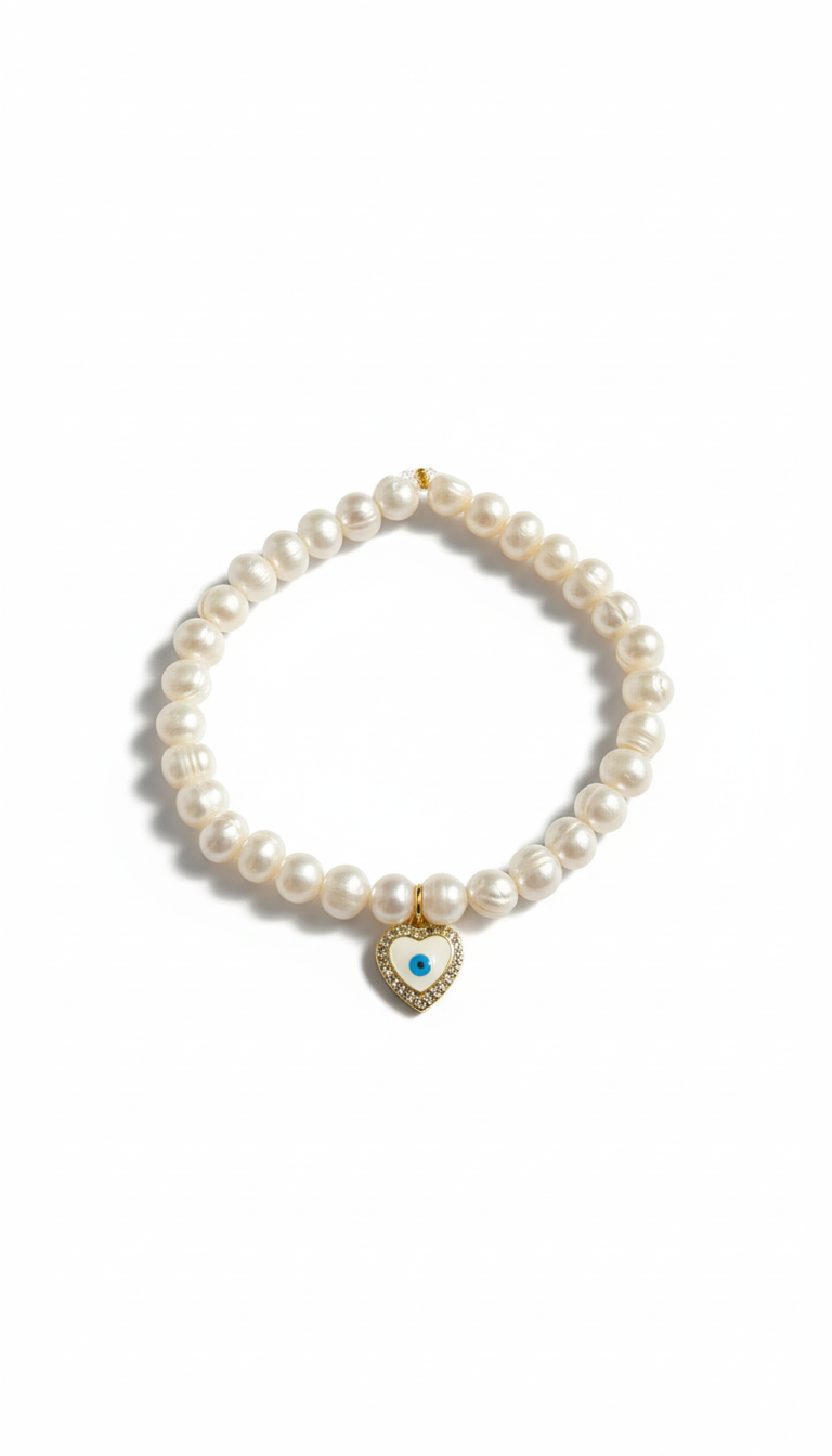 Pearl bracelet with a heart-shaped charm on a white background